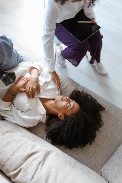 Therapist and child playing together on the floor